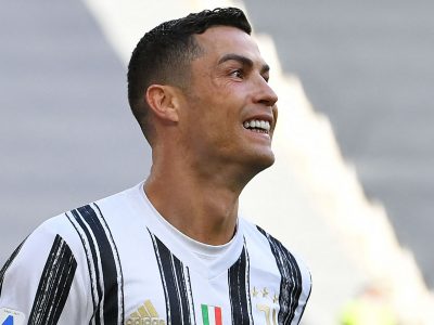 Juventus' Portuguese forward Cristiano Ronaldo celebrates after scoring a penalty to open the scoring during the Italian Serie A football match Juventus vs Inter on May 15, 2021 at the Juventus stadium in Turin. (Photo by Isabella BONOTTO / AFP) (Photo by ISABELLA BONOTTO/AFP via Getty Images)
