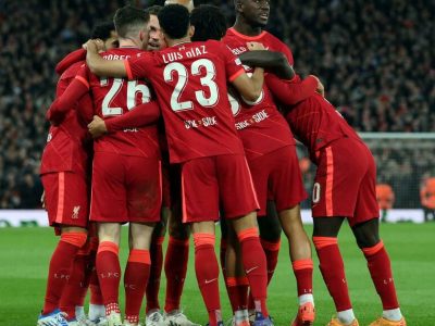 Liverpool's English midfielder Jordan Henderson celebrates with teammates after scoring a goal during the UEFA Champions League semi-final first leg football match between Liverpool and Villarreal, at the Anfield Stadium, in Liverpool, on April 27, 2022. (Photo by LLUIS GENE / AFP)